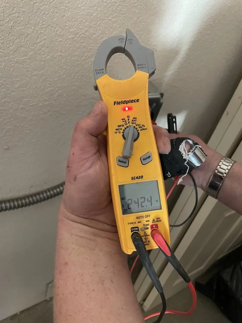 Voltage testing with clamp meter during Ceiling Fan Installation in China